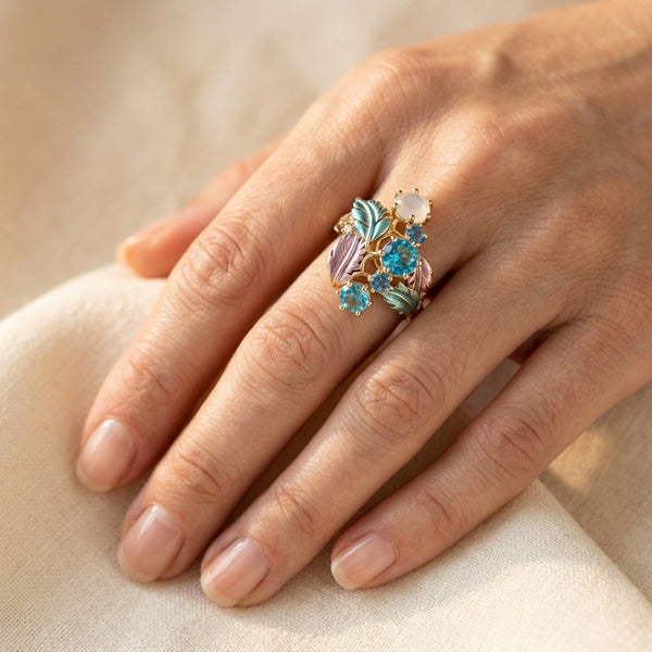 Gold-Tone Cluster Ring with Blue Stones and Enamel Leaves