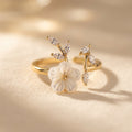 Gold-Tone Bypass Ring with Pearlescent Flower and Clear Leaves