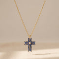 Gold-Tone Cross Pendant Necklace with Navy Marquise Stones