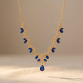 Gold-Tone Leaf Vine Necklace with Blue Stones and Pear Drop