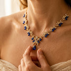 Gold-Tone Leaf Vine Necklace with Blue Stones and Pear Drop