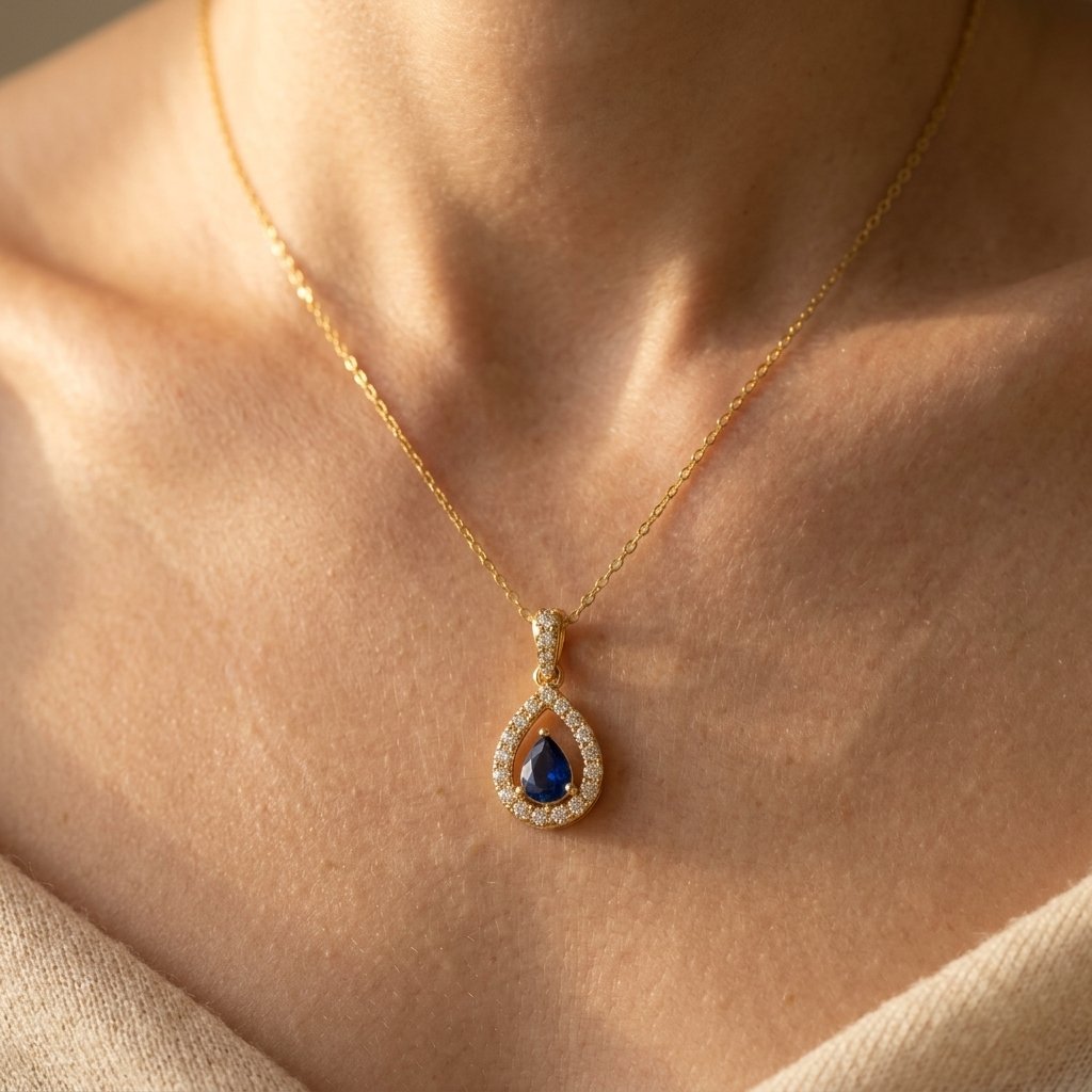 Gold-Tone Open Pear Halo Pendant with Blue Stone