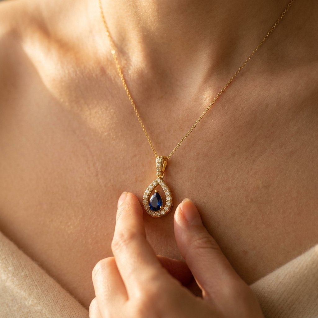Gold-Tone Open Pear Halo Pendant with Blue Stone