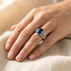 Silver-Tone Oval Blue Stone Ring with Triple Pavé Split Shank