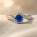 Silver-Tone Swirl Bypass Ring with Round Blue Stone