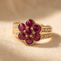 Gold-Tone Red Stone Flower Cluster Ring with Pavé Rows